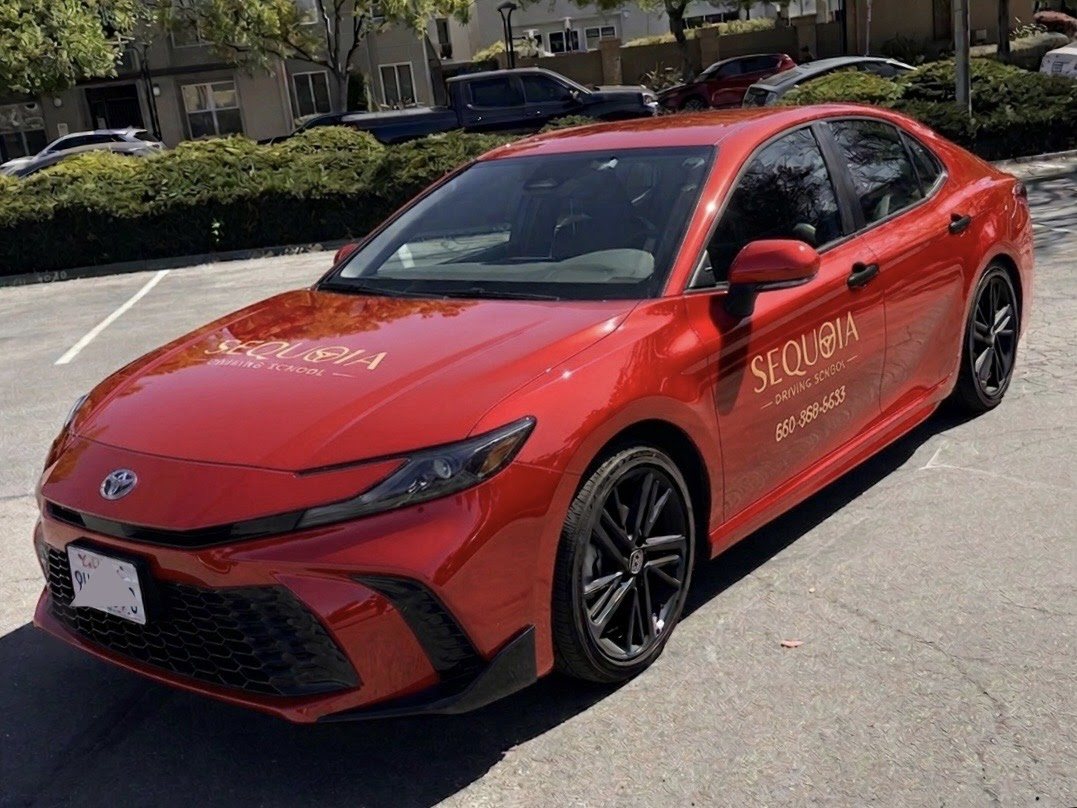 The red Toyota Camry training car